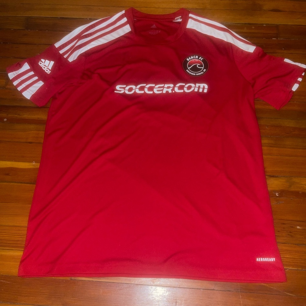 Red addidas soccer jersey, good condition, fits like medium